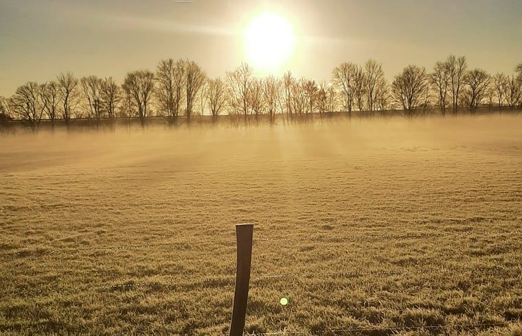 Morning sun over foggy field at Holiday home in Werkendam, West Brabant, North Brabant