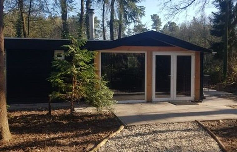 Front of Cottage in Schijf, modern vacation home in wooded West Brabant.