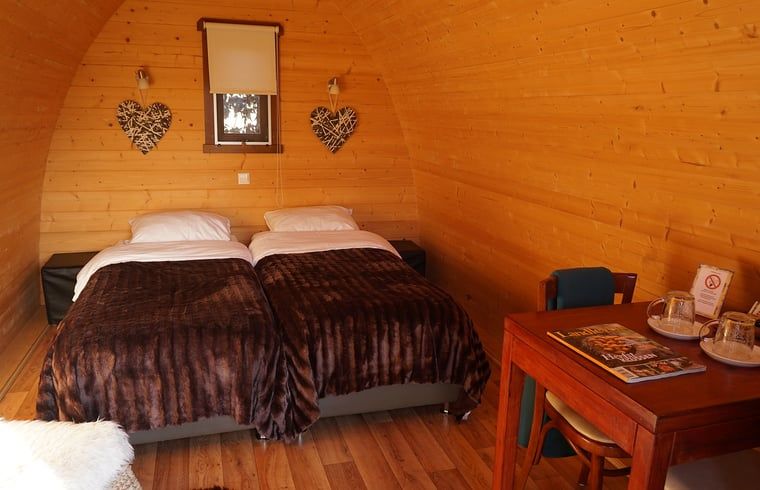 Comfortable bedroom in Cottage in Terheijden, West Brabant, with cozy furnishings.