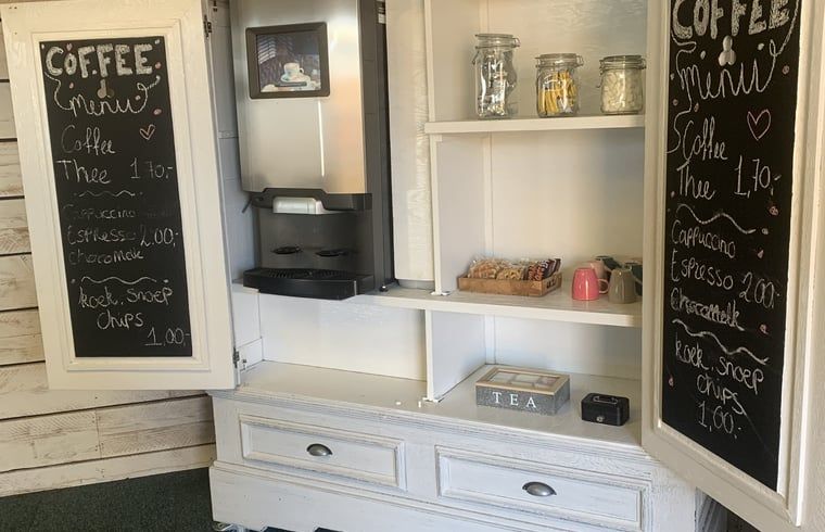 Cozy coffee corner at Huisje in Terheijden, West Brabant, with various options for guests.