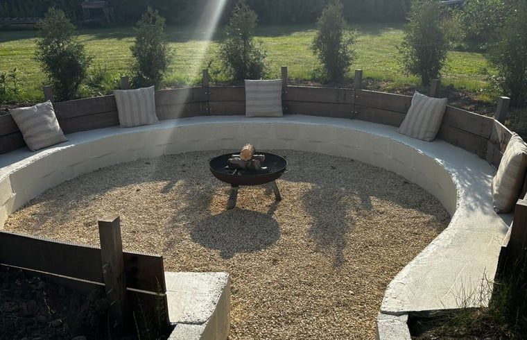 Cozy fire pit in the garden of Holiday Home in Fijnaart, West Brabant.
