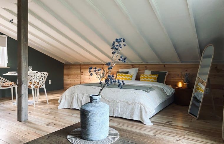 Stylish bedroom with wooden accents in Holiday home in Fijnaart, West Brabant.