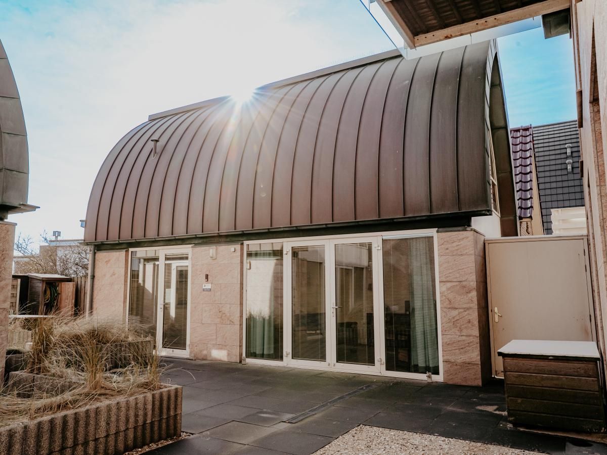 The Platvis vacation home in Egmond aan Zee features modern architecture and a sunny terrace on the North Sea coast of North Holland.