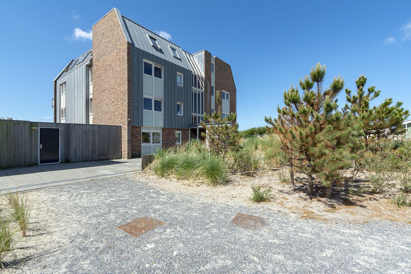 Exterior facade of Duinerei C002 Groote Keeten vacation home in Callantsoog, North Sea coast, North Holland.