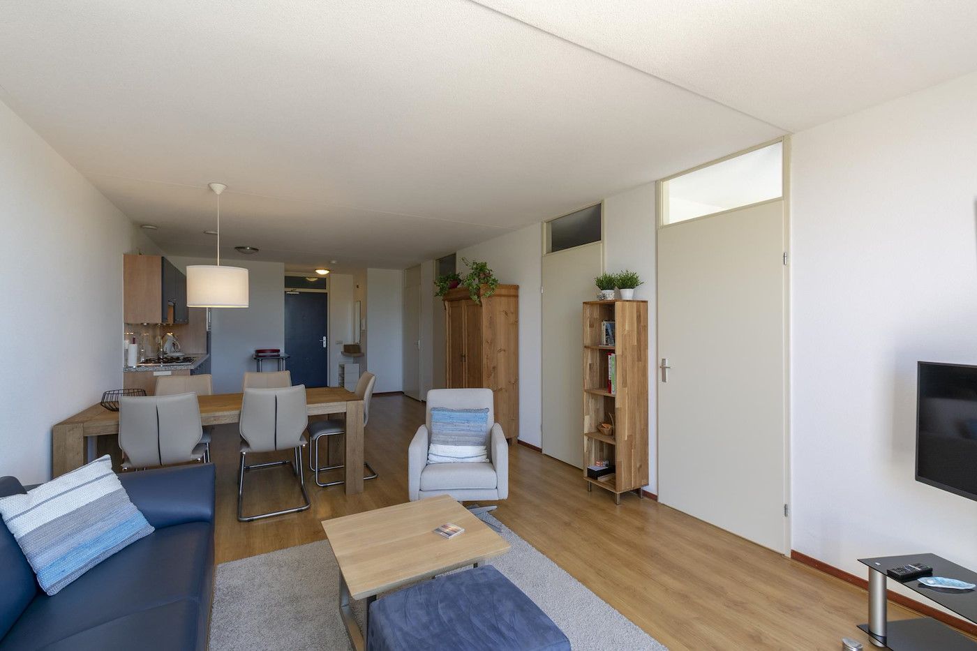 Modern living room in Duinerei C002 Groote Keeten vacation home in Callantsoog, North Sea coast, North Holland.