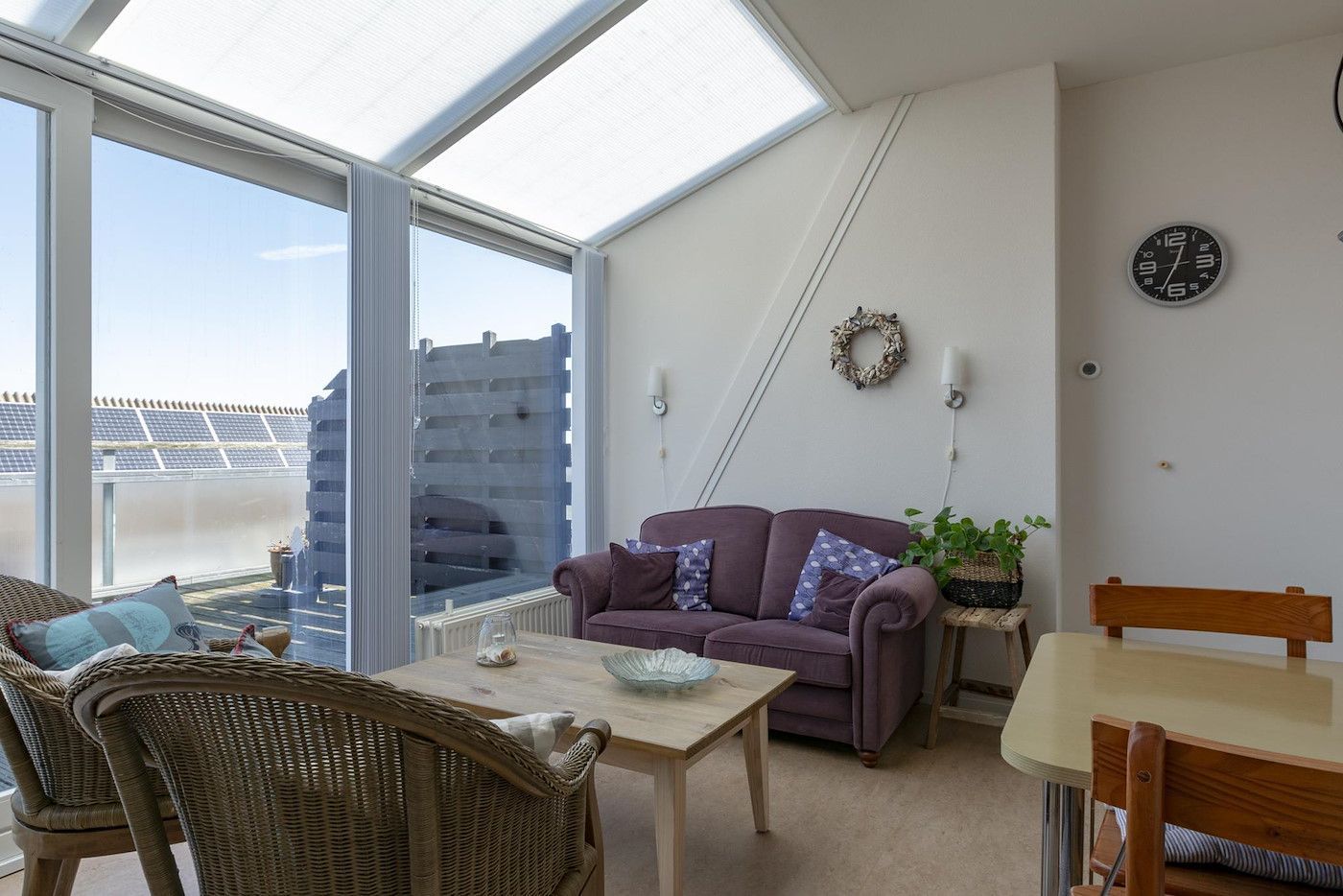 Bright living room in Dorpsplein 23E Callantsoog vacation home, with comfortable furniture, North Holland.