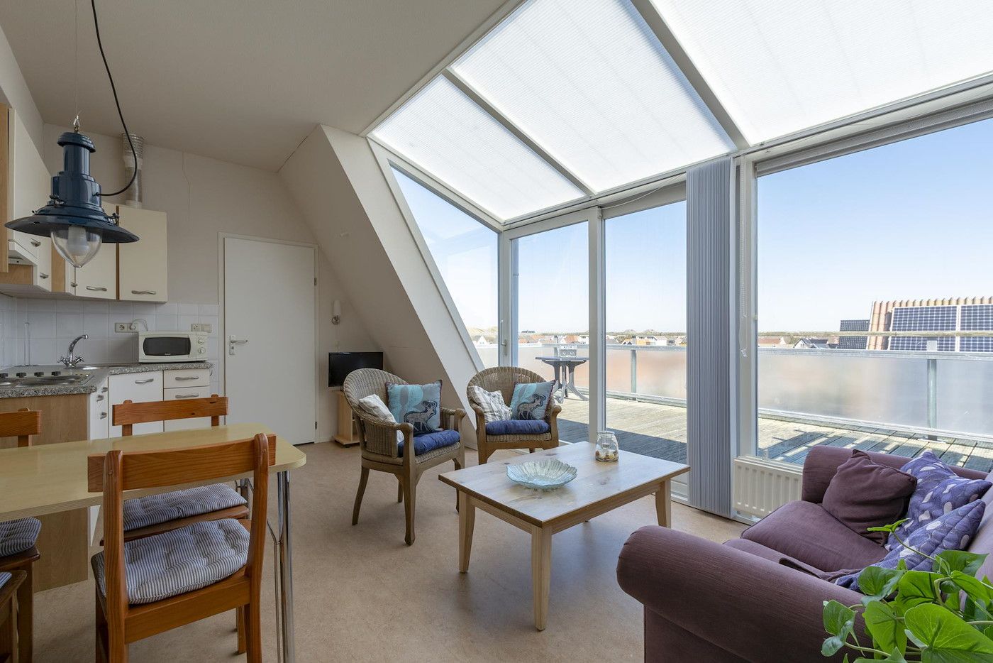 Spacious kitchen in Dorpsplein 23E Callantsoog vacation home, complete with modern amenities, North Holland.