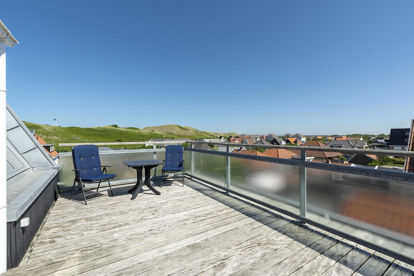 Bedroom with lots of natural light in Dorpsplein 23E Callantsoog vacation home, North Sea coast.