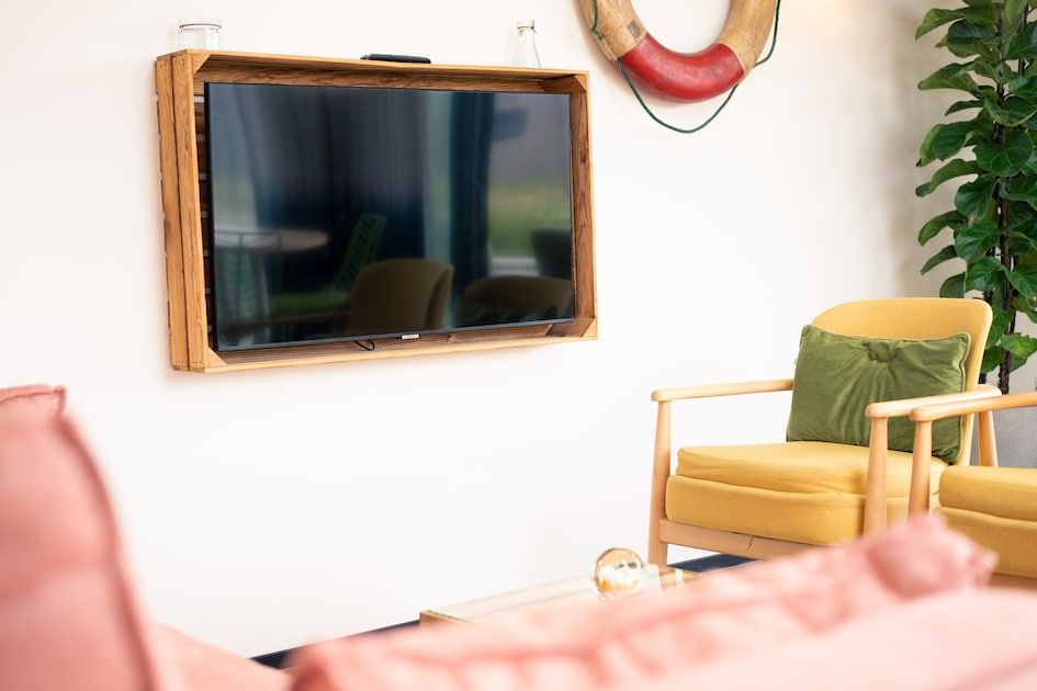 Comfortable sitting area with television in Callants Comfort 4, vacation home in Callantsoog.