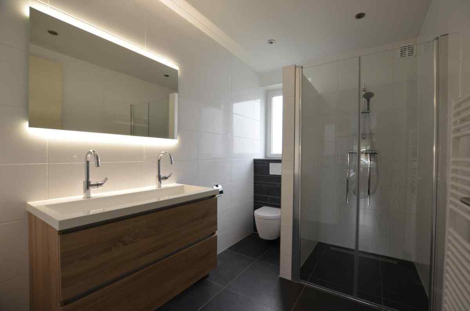 Bedroom in vacation home NH114, Julianadorp aan Zee, North Holland, overlooking trees.