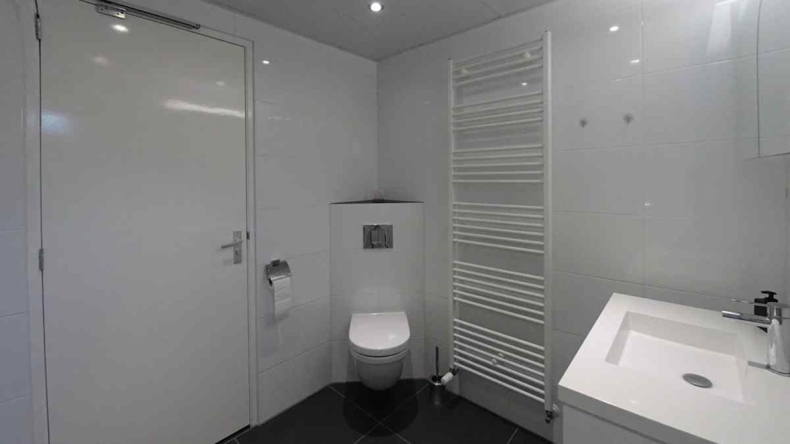 Cozy living room in vacation home NH080, Julianadorp aan Zee, overlooking the garden, North Sea coast, North Holland.