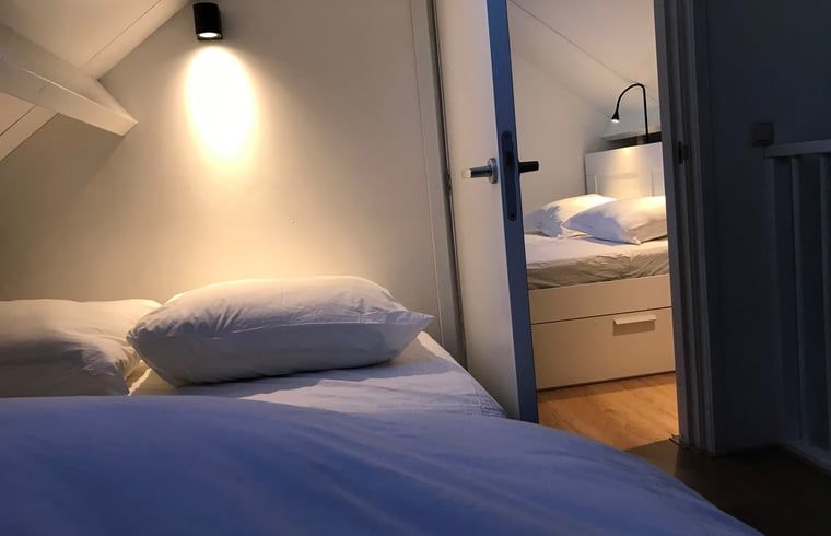 Cozy bedroom in Holiday home in Andijk, ideal for a good night's sleep on the IJsselmeer coast.