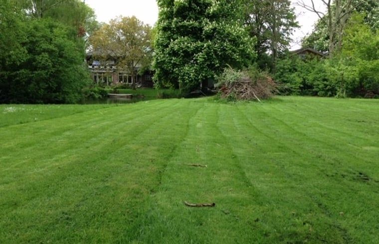 Vast green fields near Holiday Home in Andijk, perfect for walks and relaxation.