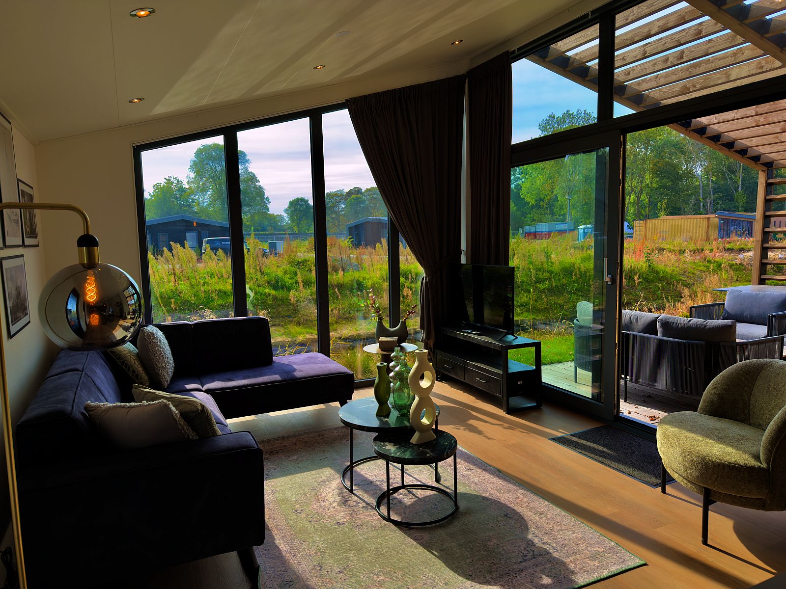 Cozy living room of detached house in Enkhuizen, located on the IJsselmeer coast, North Holland, overlooking the green surroundings.