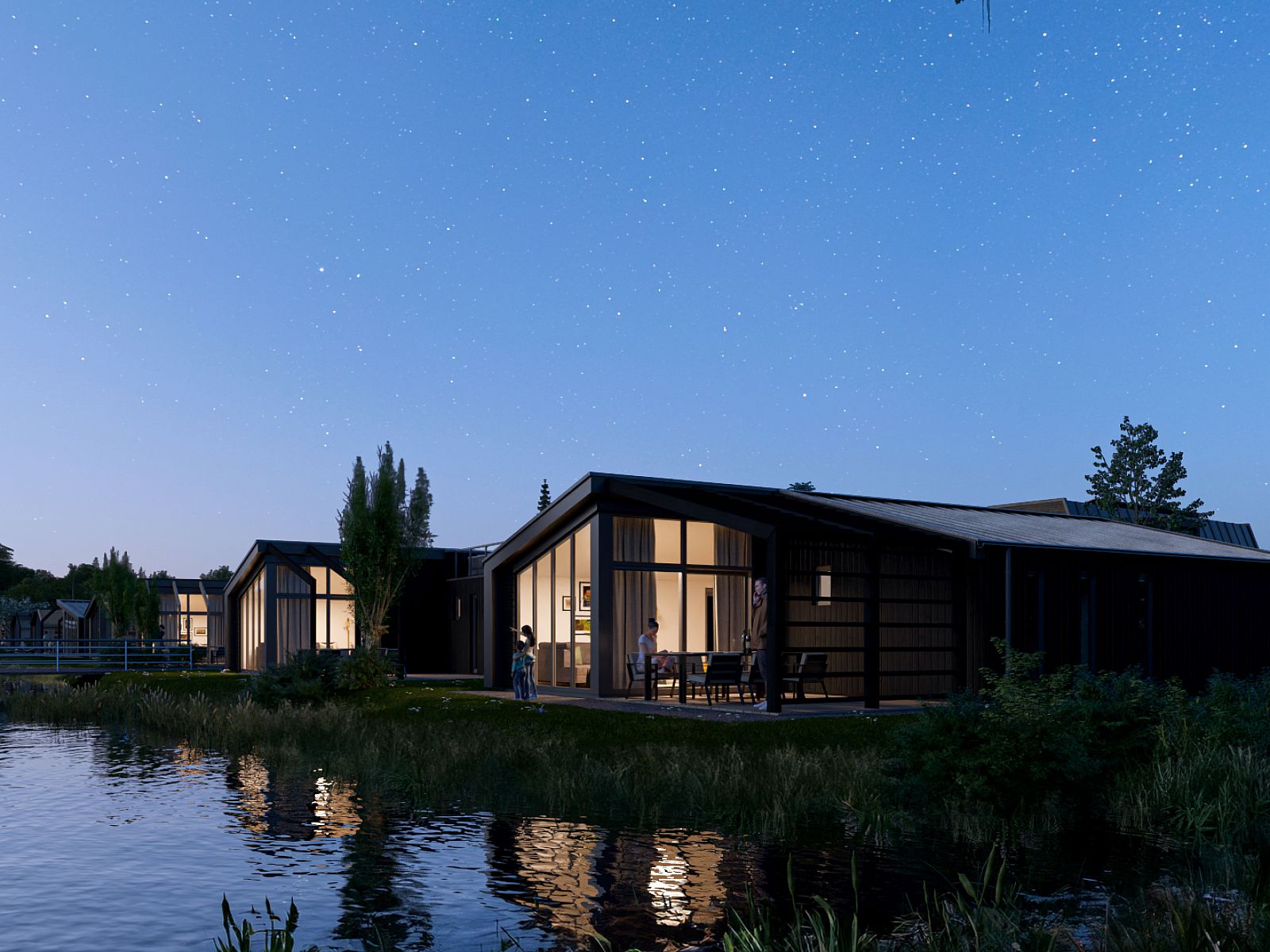 Chalet in Enkhuizen bij nacht, een sfeervol verlicht vakantiehuis aan het water onder een sterrenhemel.