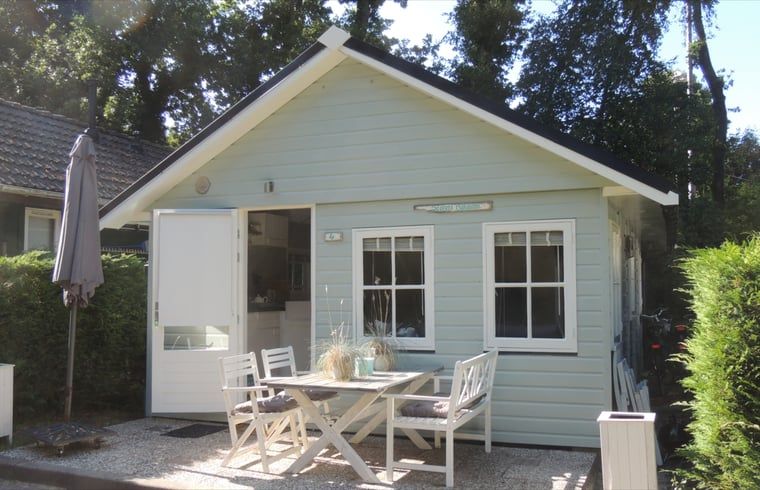 Enjoy the peace and quiet at Huisje in Schoorl, a charming vacation home in North Holland with a sunny terrace surrounded by nature.