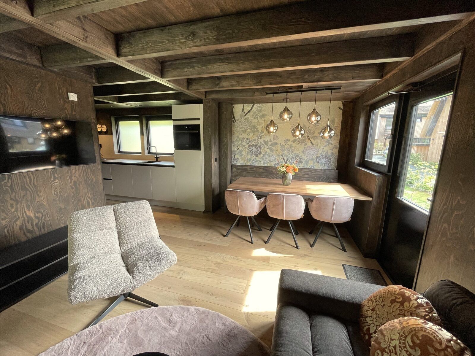 Terrace of the 6-person Dune Lodge with Charging Point in Schoorl, North Holland. Ideal place for relaxation and nature experience.