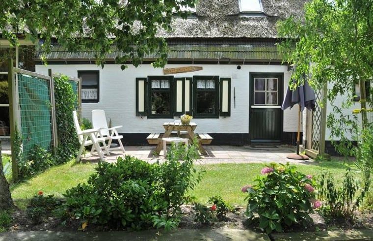 Enjoy the sunny terrace at Vakantiehuis in Schoorl, a charming vacation home in the green surroundings of North Holland North.