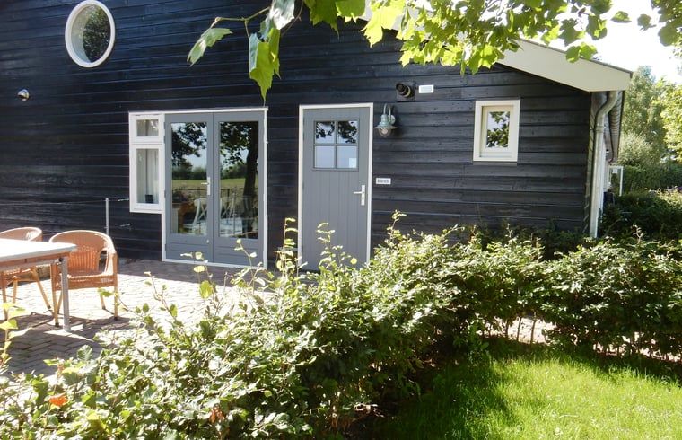 Cozy terrace at Holiday home in Weesp, Amsterdam eo, North Holland, surrounded by green nature and peaceful surroundings.