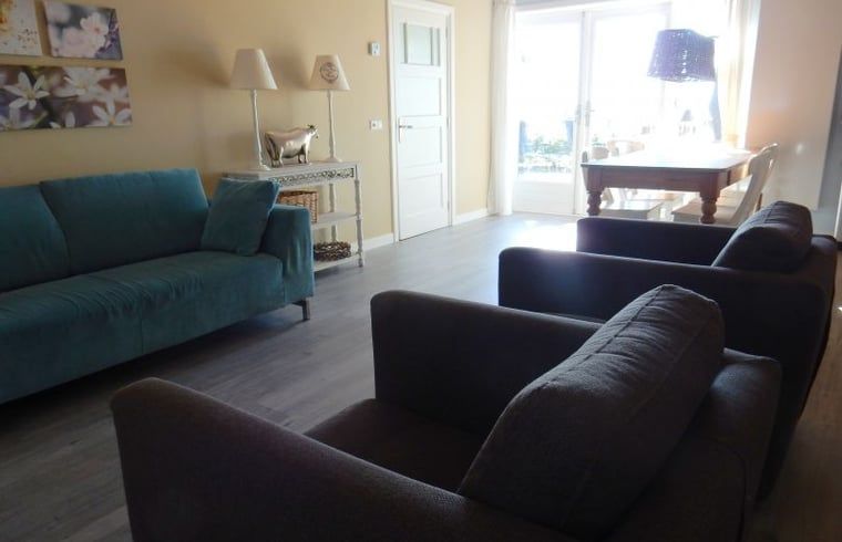 Stylish living room of Holiday Home in Weesp, Amsterdam eo, North Holland with comfortable seating area and plenty of natural light.