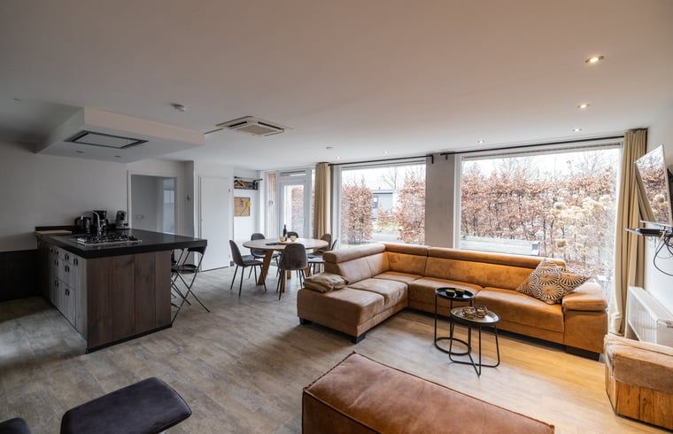 Cozy indoor area of cottage in Den Ham, Twente. Comfortable sitting area with views of nature in Overijssel.