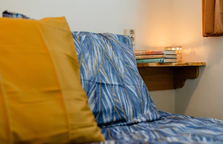 Cozy bedroom in Cottage in Den Ham, Twente, Overijssel with atmospheric lighting and comfortable beds.