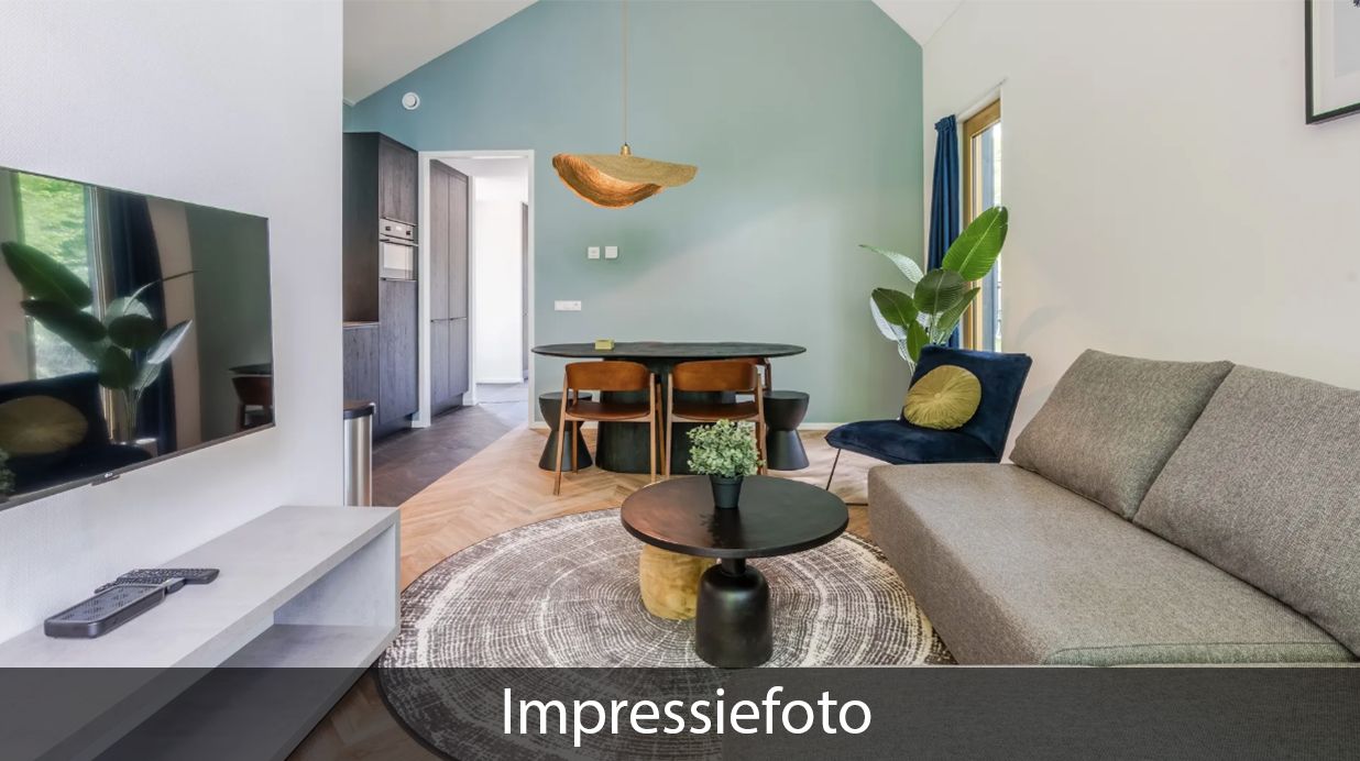 Woonkamer van Vrijstaande woning in Beuningen, Twente, vakantiehuis met comfortabele zithoek en moderne faciliteiten.