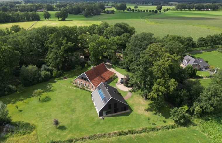 Aerial photo of House in Haaksbergen, a vacation home surrounded by green nature in Twente, Overijssel, with expansive views.