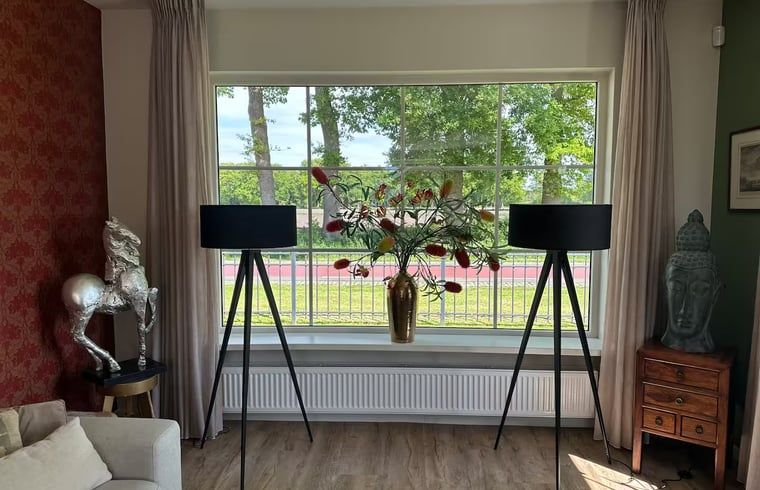 Bright interior with large windows in the cottage in Enschede, Twente.