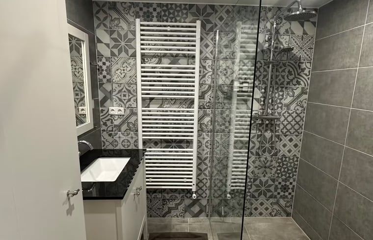 Modern bathroom with shower in cottage in Enschede, Twente.