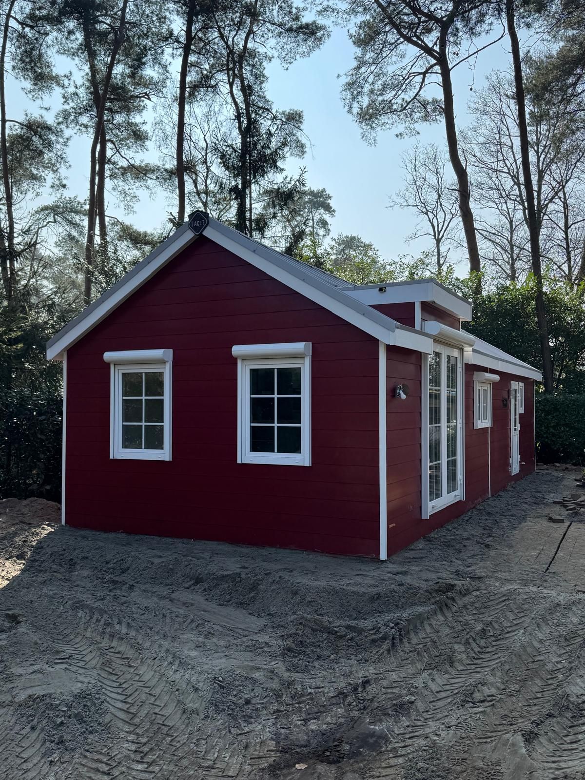 Charming red bungalow for sale in Markelo, Twente, located amidst the serene nature of Overijssel.