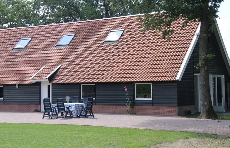 Spacious terrace at vacation home in Denekamp, Twente. Enjoy the outdoors in this cozy vacation home in Overijssel.