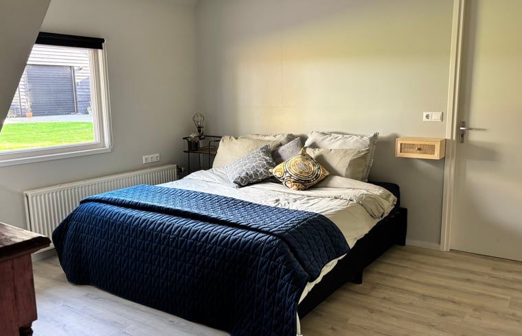 Cozy bedroom in vacation home in Denekamp, Twente, with comfortable beds. Relax in this vacation home in Overijssel.