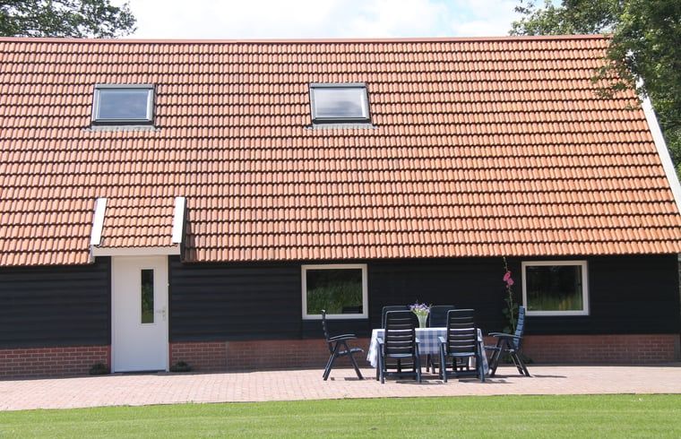 Terrace with garden furniture at vacation home in Denekamp, Twente. Relax outside at this vacation home in Overijssel.