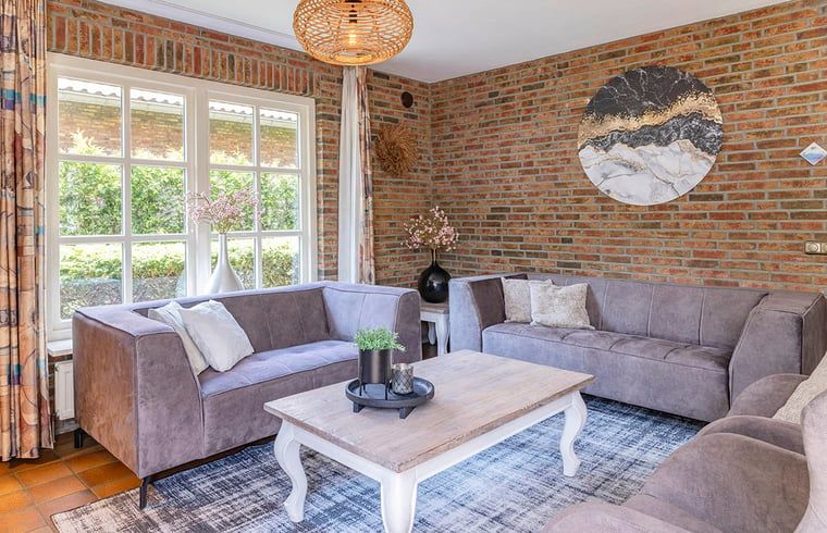 Cozy living room of Holiday home in Losser, Twente. Comfortable sitting area with natural light and stylish decor.