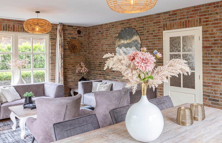 Stylish interior of Holiday Home in Losser, Twente, with comfortable seating and attractive decorations in a rural setting.
