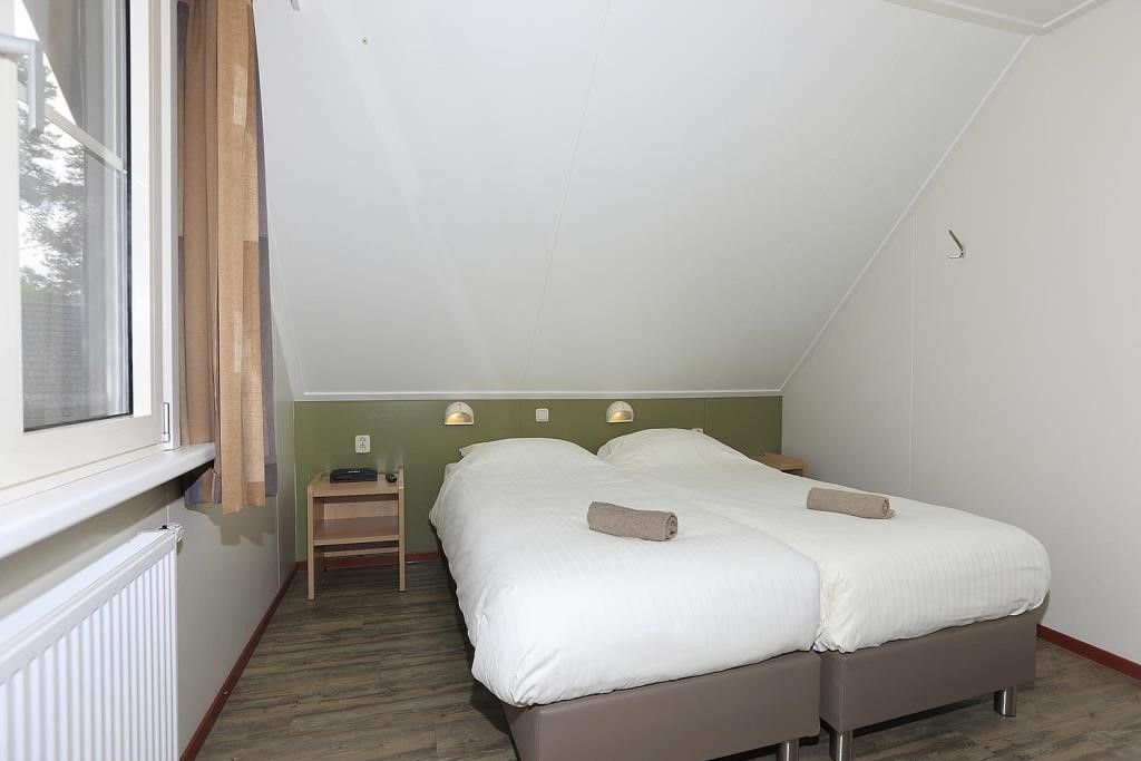 Komfortables Schlafzimmer im Ferienhaus Boshuus Comfort, Deurningen, fuer eine gute Nachtruhe.