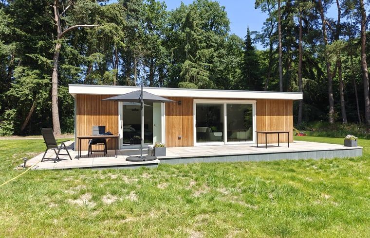 Modern vacation home Cottage in Buurse with wooden facade in Twente, Overijssel surrounded by nature.