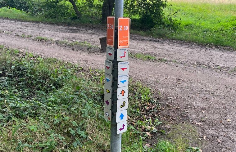 Hiking trail markers near Huisje in Buurse, vacation home in Twente, for adventurous routes.