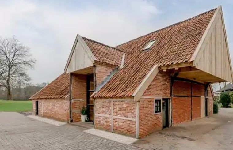 Cottage in Agelo, a charming vacation home in Twente, Overijssel, surrounded by nature and rustic architecture.