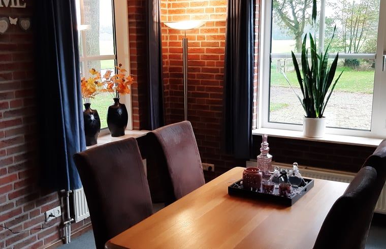 Stylish dining room in Holiday home in Lattrop Breklenkamp overlooking the greenery in Twente, Overijssel.