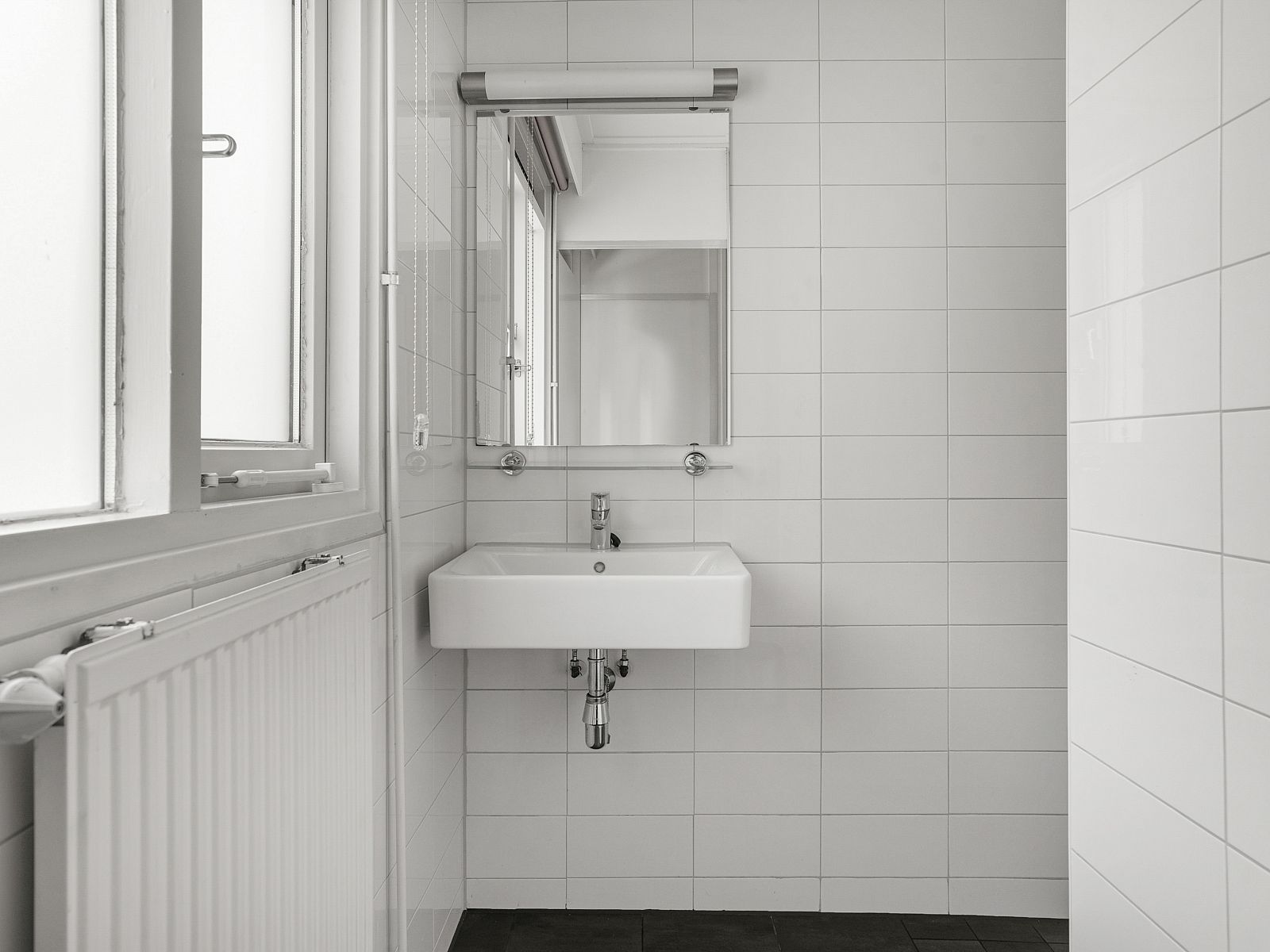 Sleek bathroom with sink in Twenhaarsveld dog bungalow, Holten, modern and functional.