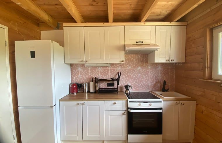Kitchen with white cabinets in Holiday home in Wijhe, Salland, Overijssel.