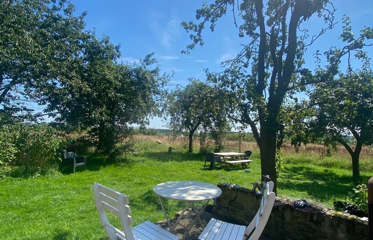 Outdoor area with seating at Holiday home in Wijhe, Salland, Overijssel.