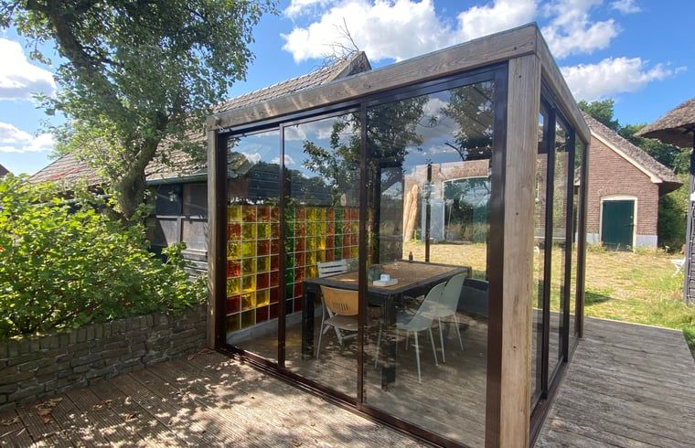 Glass conservatory with colorful wall at Holiday home in Wijhe, Salland, Overijssel.