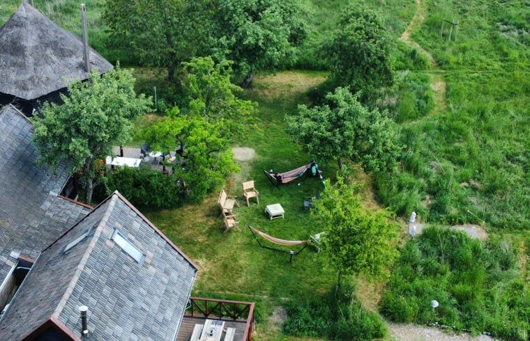 Garden with hammocks and seating at Holiday home in Wijhe, Salland, Overijssel.