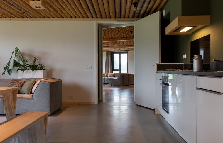 View through to living room from kitchen in Holiday Home in Heeten, ideal for a stay in Salland, Overijssel.