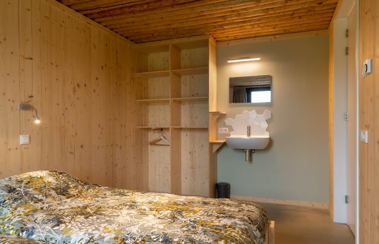 Modern bathroom with bath and shower in Holiday cottage in Heeten, ideal for a vacation in Salland, Overijssel.