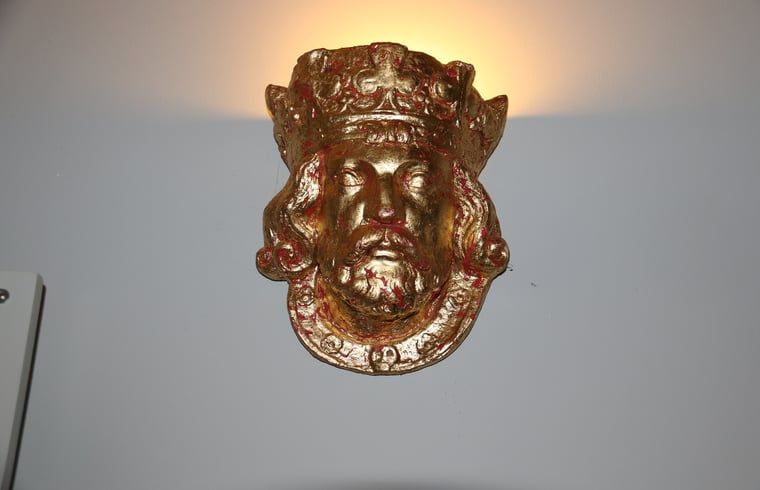 Unique wall decoration in cottage in Heeten, Overijssel, with gold details.