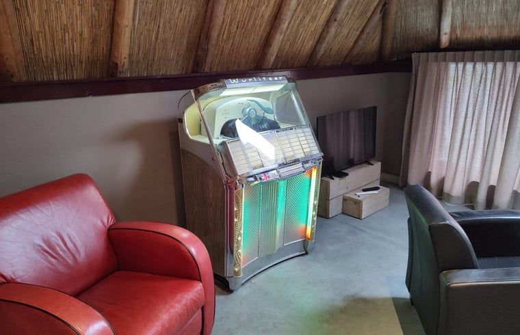 Retro jukebox in the living room of Holiday home in Nieuwleusen, Salland, Overijssel.